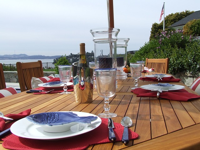 Wooden table with tableware setting, Image by Rhys Ludlow from Pixabay